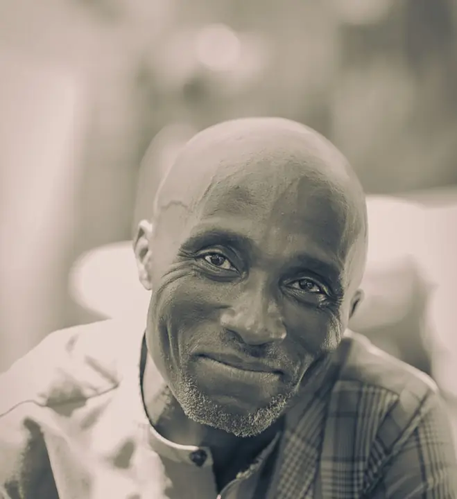 Black-and-white portrait of a smiling member