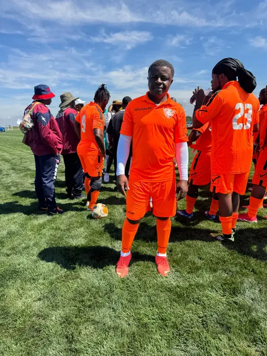 CAVFC players in orange kits on match day
